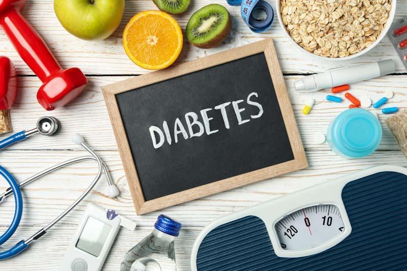 The complexities of exercise training for diabetics are shown with a scale, medications, exercise weights, proper diet and blood sugar tester are shown.