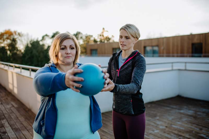 A personal trainer works with an obese client determined to change her life. Weight loss specialization for personal trainers is a growing part of the market. Learn more at EliteTrainr.com.