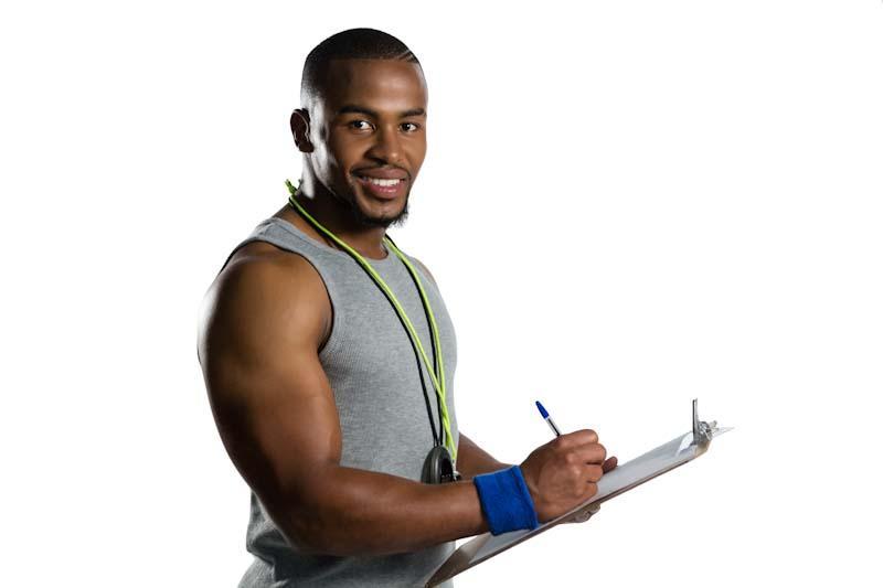 New Year's Resolutions For Your Personal Training Business. Learn how to write the most impactful resolutions for your PT business like this personal trainer is in the photo.