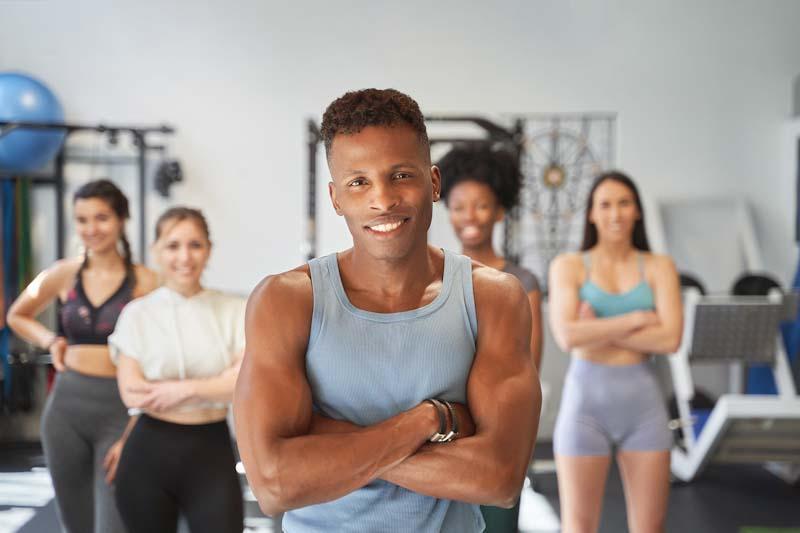 A personal trainer stands ready to motivate fitness clients through the winter blues. Learn more at EliteTrainr.com.