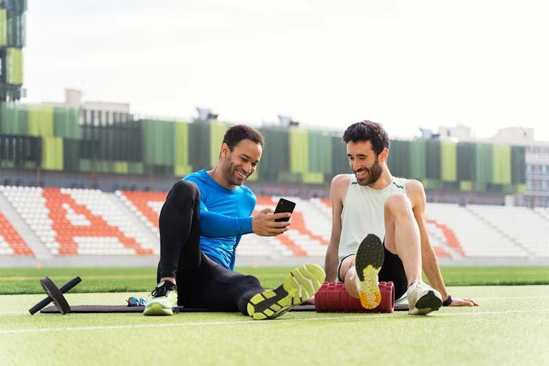 5 Reasons Your Fitness Business Needs an App Like Elite Trainr, being used by a personal athletic trainer with his client in this file photo.
