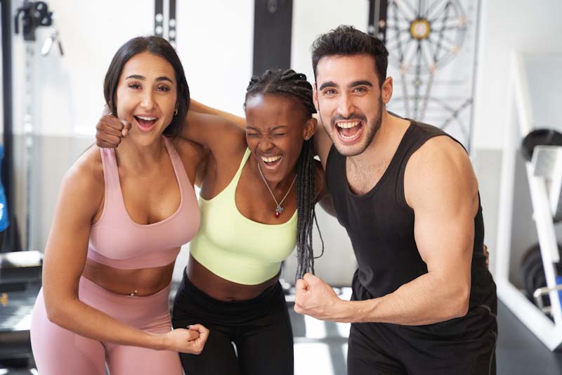 Fitness clients are shown highly engaged with their favorite personal trainer.